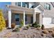Covered front porch with white columns and landscaping at 1076 Allspice Way, Lawrenceville, GA 30045