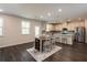 Modern kitchen with stainless steel appliances and island at 1076 Allspice Way, Lawrenceville, GA 30045