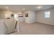 Spacious loft area with neutral carpet and multiple windows at 1076 Allspice Way, Lawrenceville, GA 30045