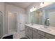 Elegant double vanity bathroom with marble floors and a large shower at 1076 Allspice Way, Lawrenceville, GA 30045