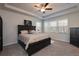 Large main bedroom with carpeted floors and ceiling fan at 1076 Allspice Way, Lawrenceville, GA 30045