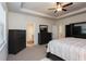 Main bedroom with carpet, large windows, and access to en-suite bathroom at 1076 Allspice Way, Lawrenceville, GA 30045