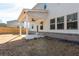 Covered patio with ceiling fan, overlooks fenced backyard at 1076 Allspice Way, Lawrenceville, GA 30045