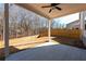 Covered patio with ceiling fan, overlooking fenced backyard at 1076 Allspice Way, Lawrenceville, GA 30045