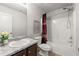 Bright bathroom featuring a shower-tub, single sink vanity with granite countertop, and a neutral color palette at 7174 Fringe Flower Dr # 21, Austell, GA 30168
