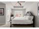 This bedroom features a large carpeted floor, a large window, a private balcony, and a queen bed at 7174 Fringe Flower Dr # 21, Austell, GA 30168