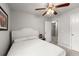 Cozy bedroom featuring soft carpet, neutral walls, and a modern ceiling fan, creating a serene and restful space at 7174 Fringe Flower Dr # 21, Austell, GA 30168