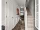 Inviting entryway showcasing hardwood floors, wainscoting, and a staircase, creating a warm and welcoming ambiance at 7174 Fringe Flower Dr # 21, Austell, GA 30168