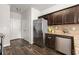 Kitchen area with stainless steel refrigerator, dishwasher, and granite countertops at 7174 Fringe Flower Dr # 21, Austell, GA 30168