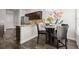 Well-lit kitchen with stainless steel appliances, granite countertops and an adjacent dining area at 7174 Fringe Flower Dr # 21, Austell, GA 30168