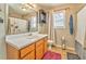 Clean bathroom with wood vanity, shower/tub combo, and updated fixtures at 108 Ivy Trace Ln, Dallas, GA 30157