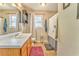 Clean bathroom with wood vanity, shower/tub combo, and updated fixtures at 108 Ivy Trace Ln, Dallas, GA 30157