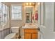 Clean bathroom with wooden vanity and shower at 108 Ivy Trace Ln, Dallas, GA 30157