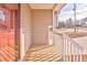 Small wooden front porch with white railings at 108 Ivy Trace Ln, Dallas, GA 30157
