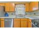 Bright kitchen with wood cabinets, stainless steel appliances, and white countertops at 108 Ivy Trace Ln, Dallas, GA 30157