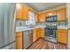 Bright kitchen with wood cabinets, stainless steel appliances, and white countertops at 108 Ivy Trace Ln, Dallas, GA 30157