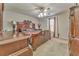 Spacious main bedroom with large wood furniture and ceiling fan at 108 Ivy Trace Ln, Dallas, GA 30157