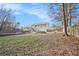 A large backyard shows a home with a deck, a pool, a trampoline, and a shed at 118 Gilberts Way, Temple, GA 30179