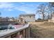 View of the backyard featuring a pool, a deck and a two story home with a deck at 118 Gilberts Way, Temple, GA 30179