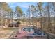 Spacious backyard features an above ground pool, deck, storage shed and mature trees at 118 Gilberts Way, Temple, GA 30179