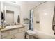 Bright bathroom with a tub and shower combination and a single sink vanity with storage at 118 Gilberts Way, Temple, GA 30179