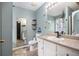 Bathroom featuring a toilet, sink, mirror and a built-in tub at 118 Gilberts Way, Temple, GA 30179