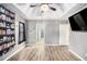 This primary bedroom boasts a ceiling fan, tray ceiling, and en suite bathroom at 118 Gilberts Way, Temple, GA 30179