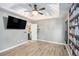 Primary bedroom with hardwood floors, walk-in closet and en suite bathroom at 118 Gilberts Way, Temple, GA 30179