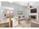 Bright living room features a fireplace and a staircase leading to the upper level at 118 Gilberts Way, Temple, GA 30179