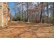 Expansive backyard with mature trees, offering a private and serene outdoor space at 1525 Terrell Mill Se Pl # A, Marietta, GA 30067
