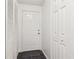 Bright entryway featuring a white door, tile floor, and multiple storage closets at 1525 Terrell Mill Se Pl # A, Marietta, GA 30067