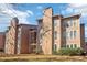 Exterior of a multi-Gathering home with a flat, grassy front yard and mature landscaping at 1525 Terrell Mill Se Pl # A, Marietta, GA 30067
