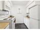 Bright kitchen features white appliances, a classic design and ample storage at 1525 Terrell Mill Se Pl # A, Marietta, GA 30067