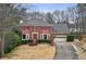 Brick house with a long driveway and landscaping at 780 Birch Ridge Dr, Roswell, GA 30076