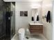 Modern bathroom with herringbone tile shower, floating vanity, and toilet at 943 Peachtree Ne St # 902, Atlanta, GA 30309
