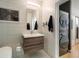 Modern bathroom with floating vanity, toilet and washer-dryer combo at 943 Peachtree Ne St # 902, Atlanta, GA 30309