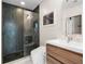 Modern bathroom with herringbone tile shower, floating vanity, and toilet at 943 Peachtree Ne St # 902, Atlanta, GA 30309