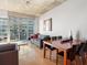 Modern dining area with hardwood floors and a wood table for six at 943 Peachtree Ne St # 902, Atlanta, GA 30309