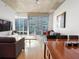 Spacious dining area with hardwood floors, large windows and city views at 943 Peachtree Ne St # 902, Atlanta, GA 30309