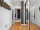Light and airy hallway with hardwood floors and mirrored closet at 943 Peachtree Ne St # 902, Atlanta, GA 30309