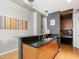 Modern kitchen with wood cabinets, granite countertops and breakfast bar at 943 Peachtree Ne St # 902, Atlanta, GA 30309