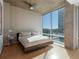 Main bedroom with city views and hardwood floors at 943 Peachtree Ne St # 902, Atlanta, GA 30309