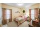Charming bedroom with a vintage bed and neutral decor at 9545 Grande Dr, Winston, GA 30187