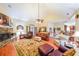 Spacious living room featuring a stone fireplace and hardwood floors at 9545 Grande Dr, Winston, GA 30187