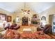 Living room features hardwood floors, stone fireplace, and comfy seating at 9545 Grande Dr, Winston, GA 30187