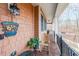 Inviting front porch with rocking chair, brick flooring, and wooded views at 9545 Grande Dr, Winston, GA 30187