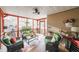 Relaxing screened porch with seating area and ceiling fan at 9545 Grande Dr, Winston, GA 30187