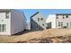 Rear view of the house, showcasing the lawn and the house's green siding at 4722 Blake Loop, Atlanta, GA 30349