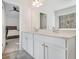 Bathroom features double sinks, white cabinets, and a view of the bedroom at 4722 Blake Loop, Atlanta, GA 30349