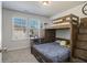 bedroom with a custom bunk bed that has a built in desk and dresser at 4722 Blake Loop, Atlanta, GA 30349